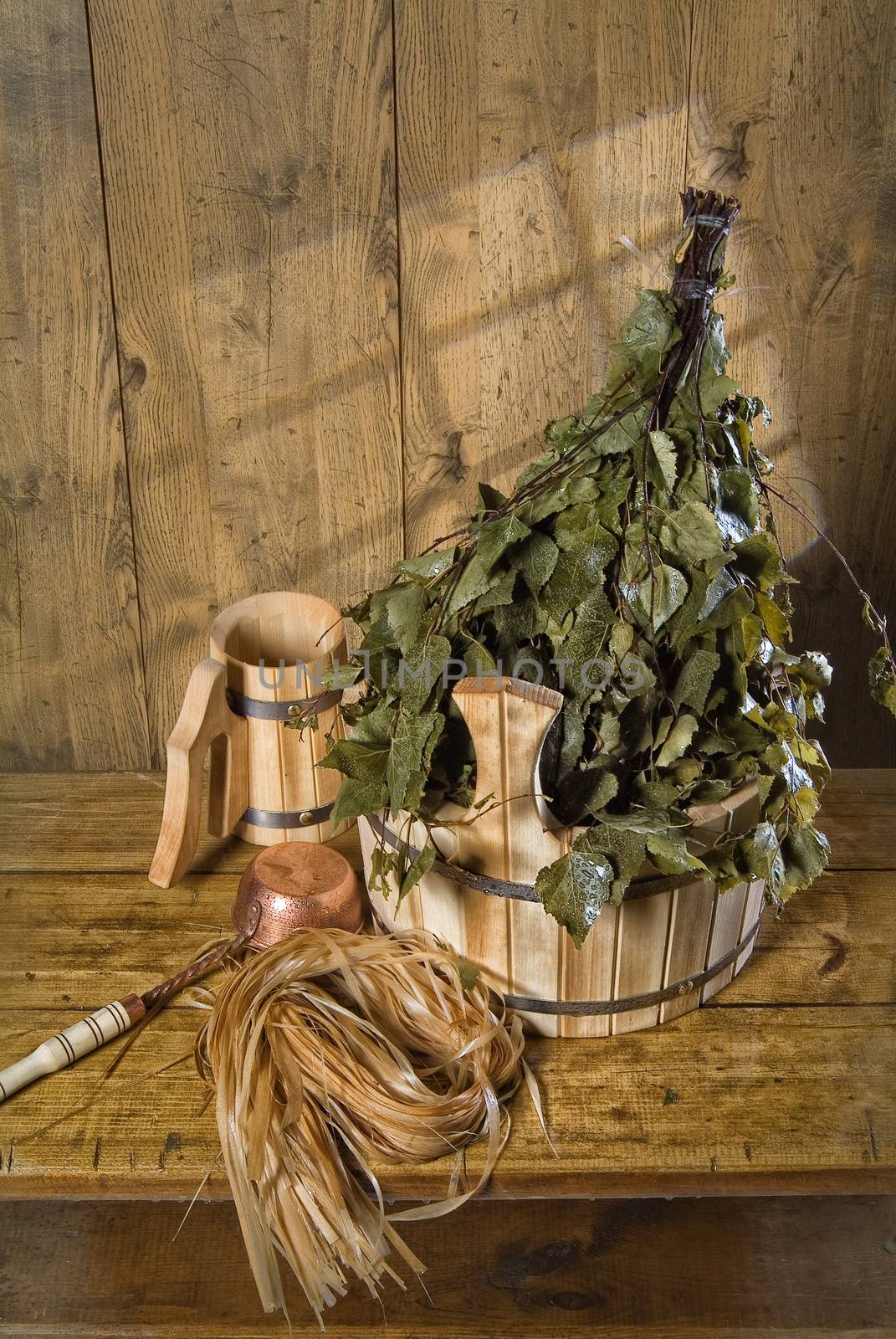 Russian traditional bath accessories on a wooden background