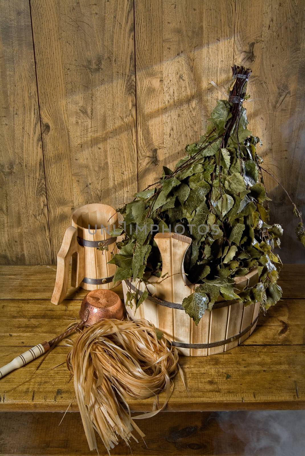Russian traditional bath accessories on a wooden background