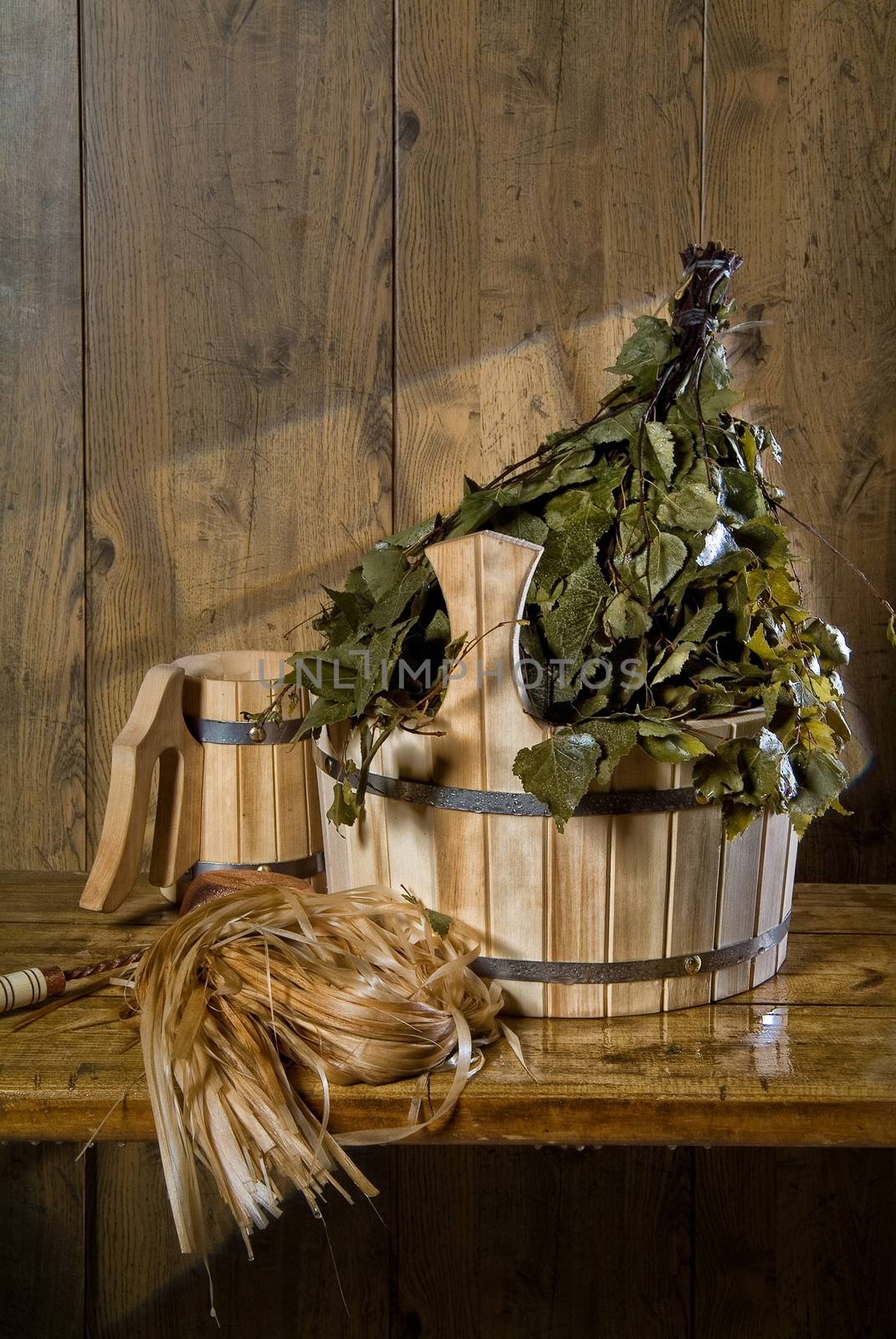 Russian traditional bath accessories on a wooden background