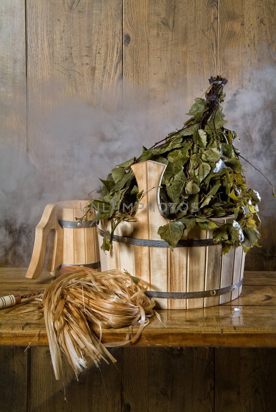 Russian traditional bath accessories on a wooden background
