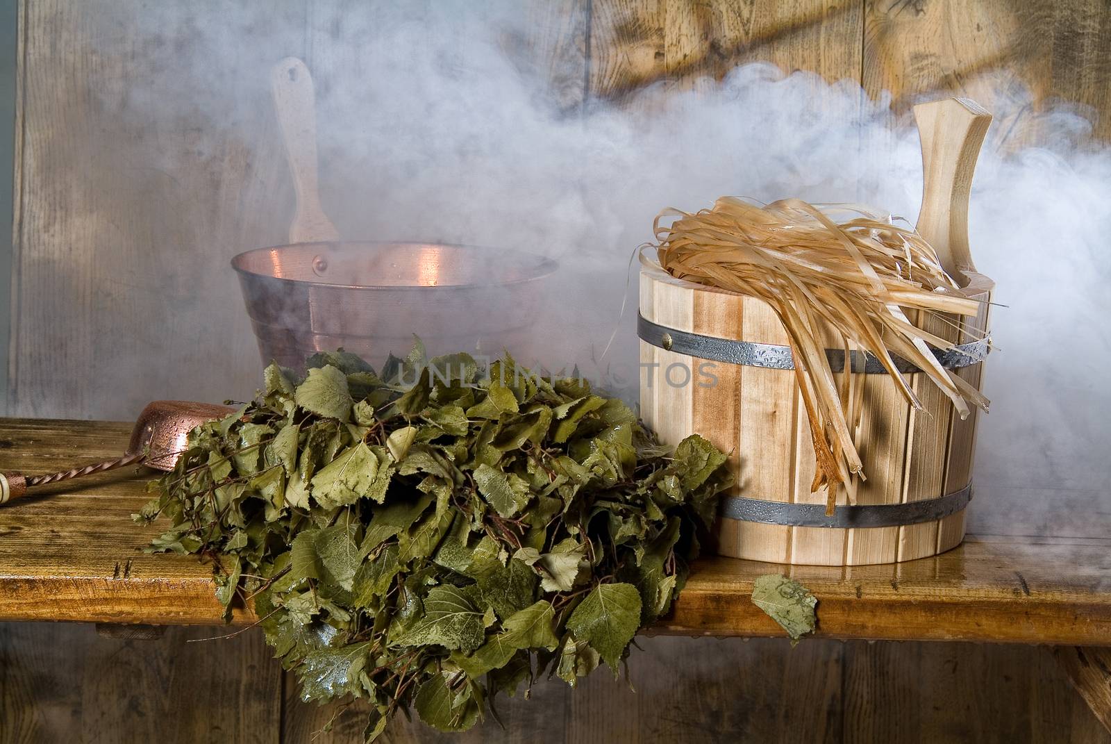 Russian traditional bath accessories on a wooden background