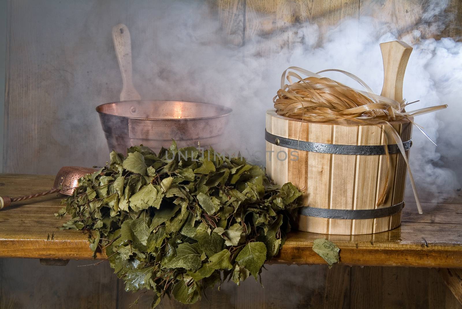Russian traditional bath accessories on a wooden background