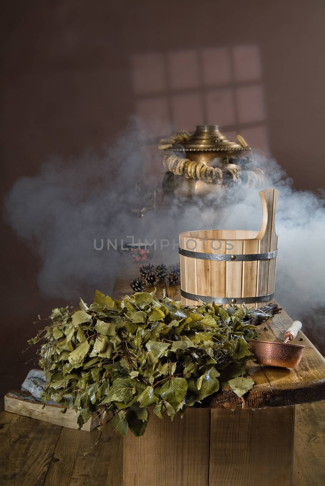 Russian traditional bath accessories on a wooden background