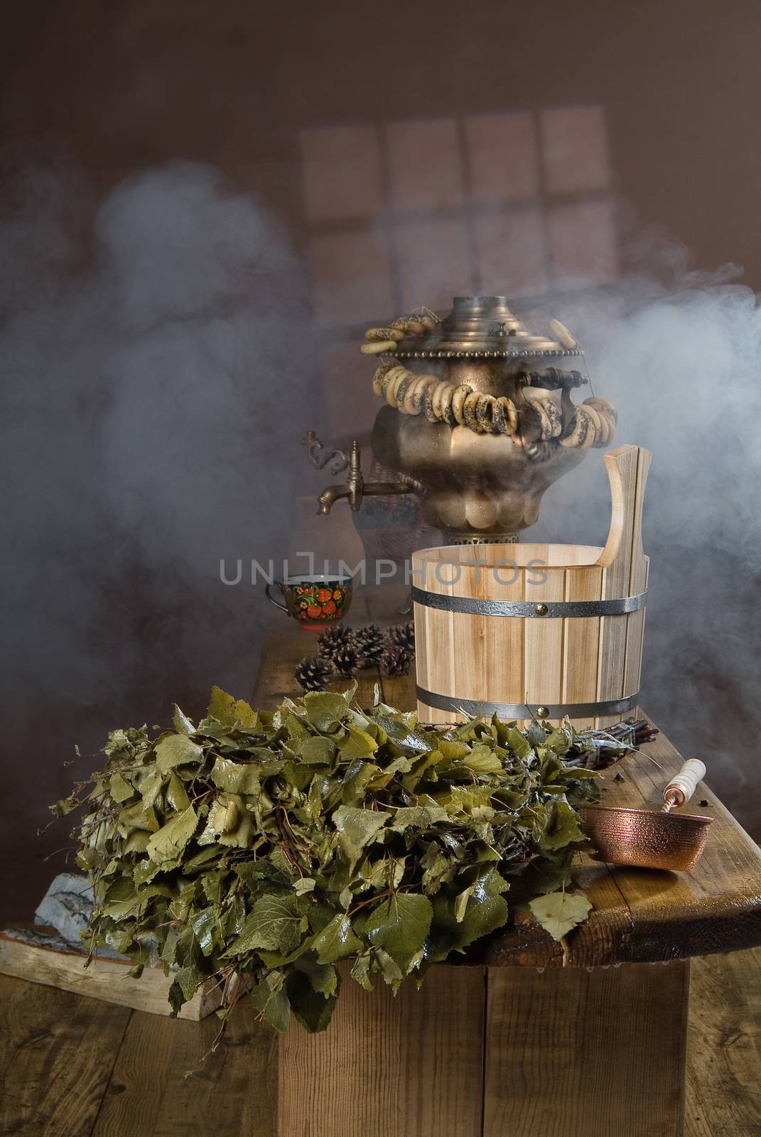 Russian traditional bath accessories on a wooden background