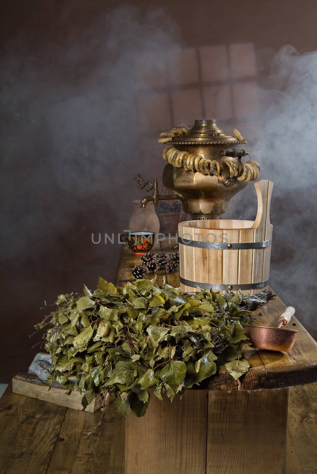 Russian traditional bath accessories on a wooden background