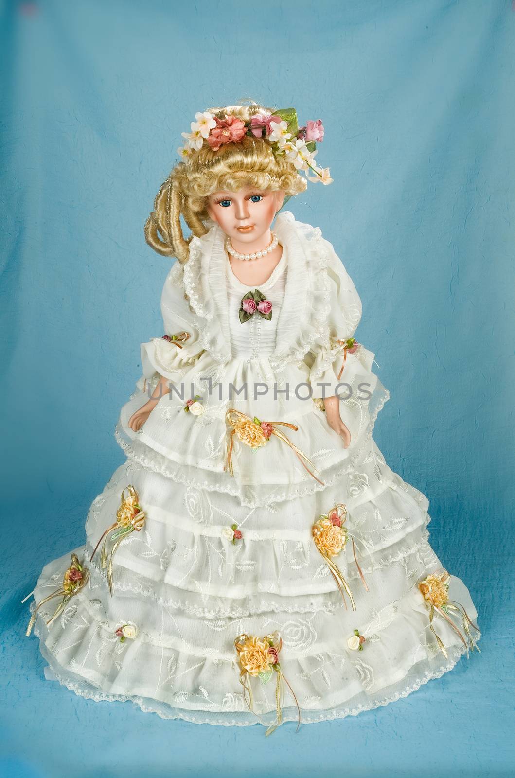 Doll dressed in retro style on a studio background