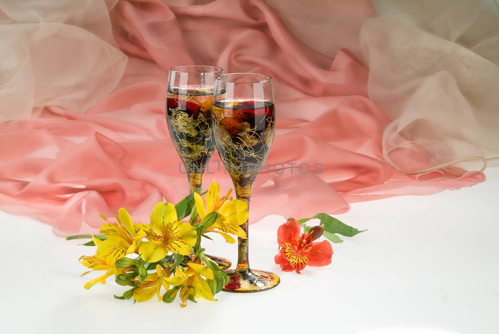 Still life with bouquet of flowers and accessories on a studio background