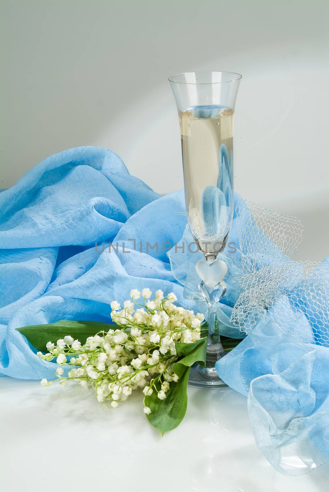 Still life with bouquet of flowers and accessories on a studio background