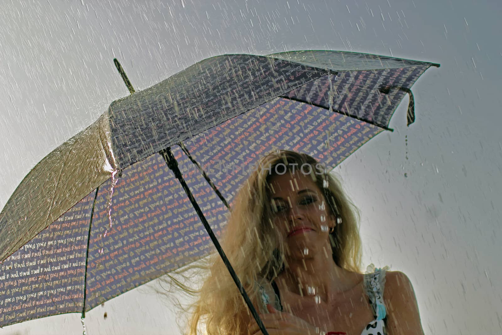 smiling blonde girl in the dress with umbrella, rainy weather by zakob337