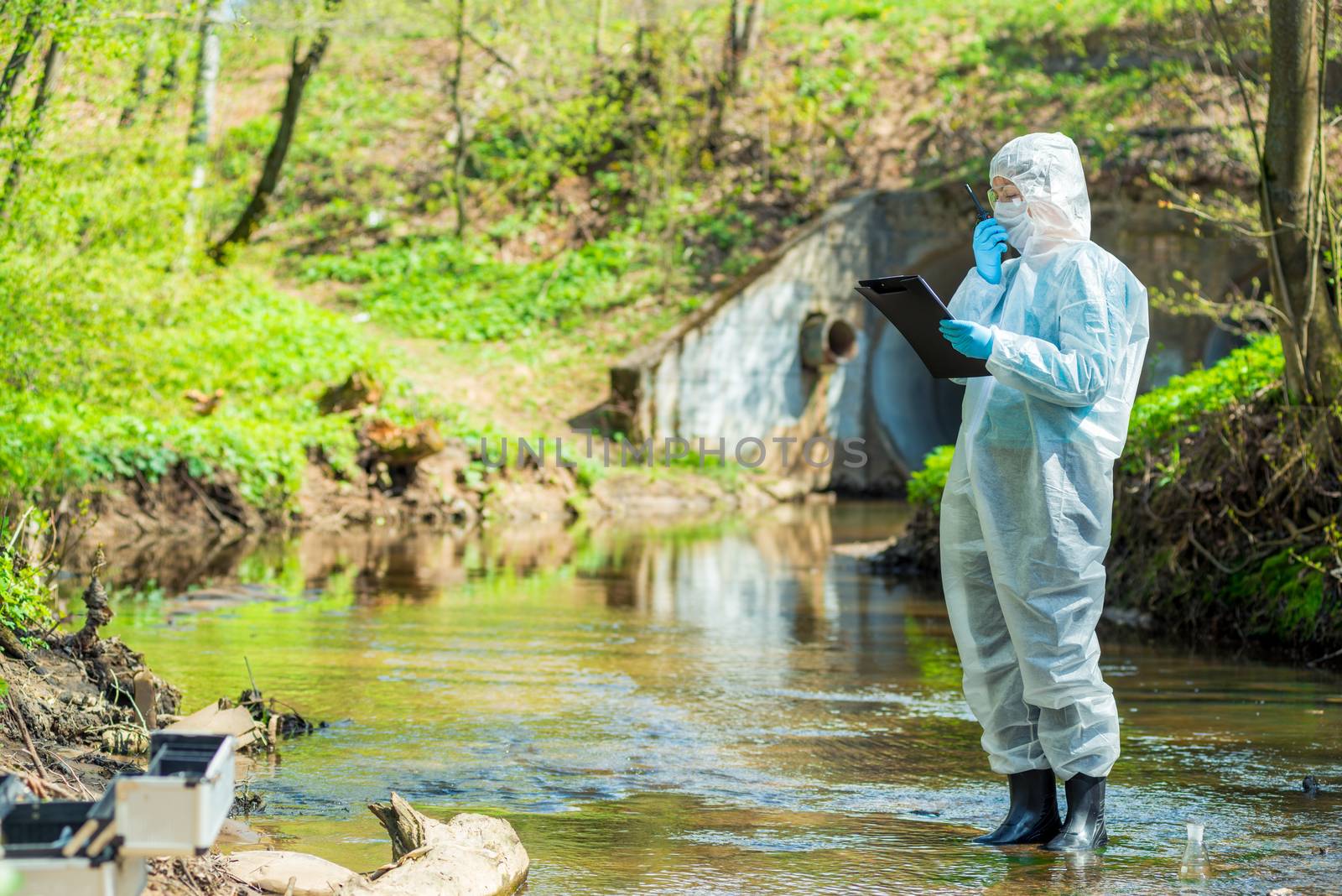 scientist doing research on the environment and water in the sewer creek