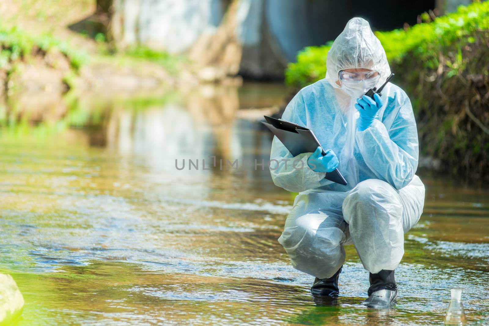 ecologist scientist while conducting research on sewage contamination