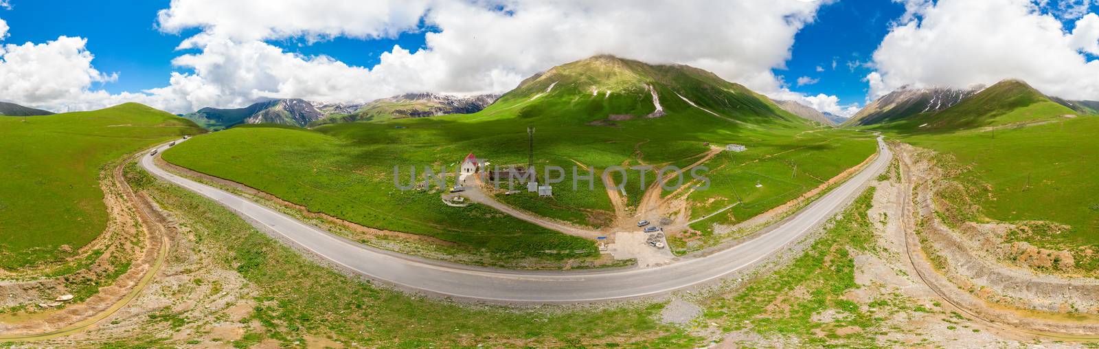 winding Georgian Military Road surrounded by mountains landscape panorama of Georgia
