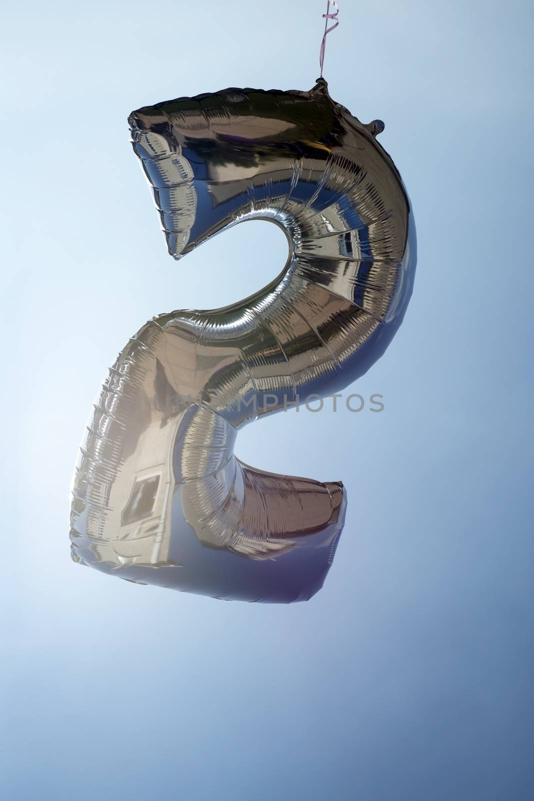 number 2 helium filled balloon against a blue sky
