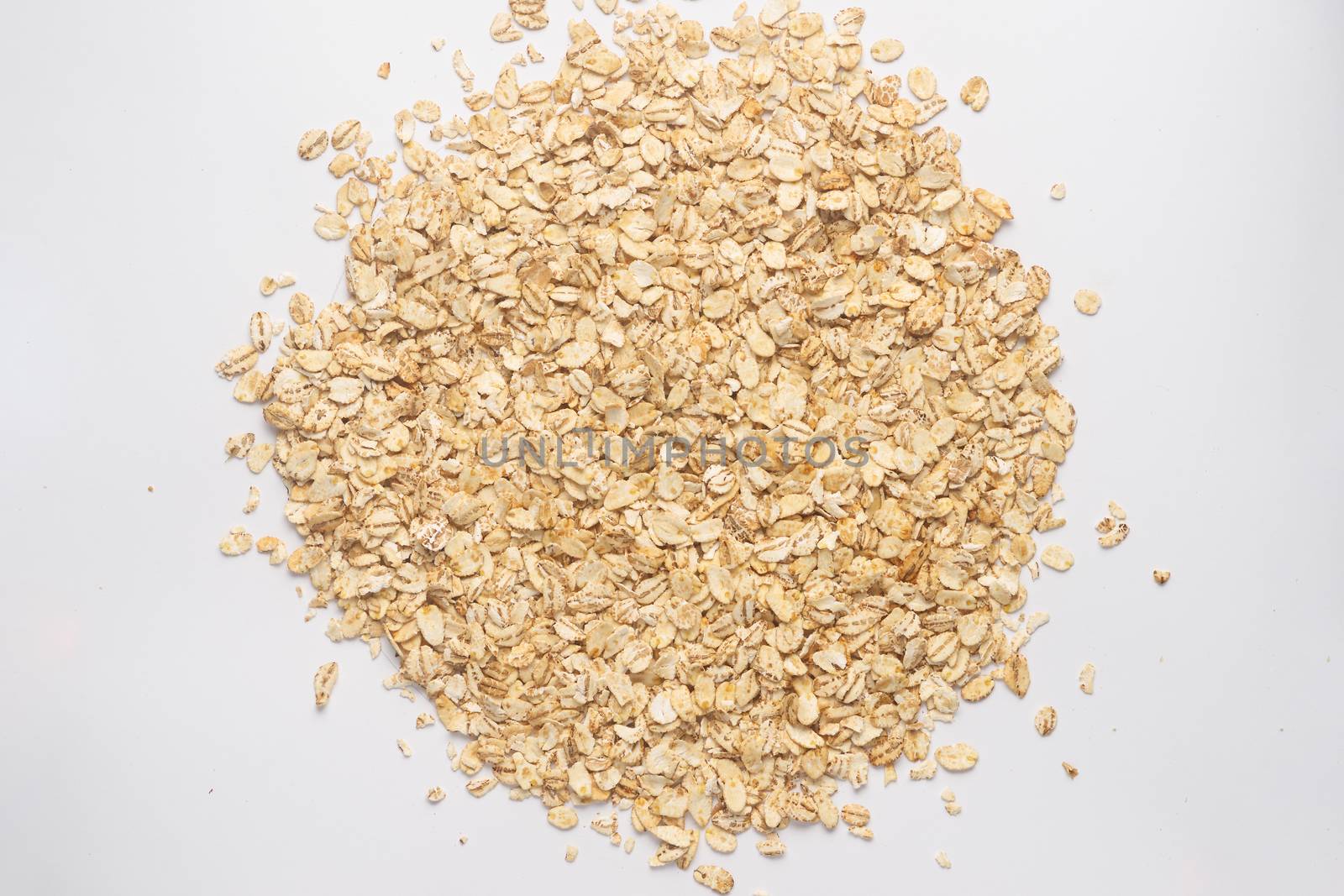 Cereal flakes for granola closeup. Flakes isolated on white back by alexsdriver