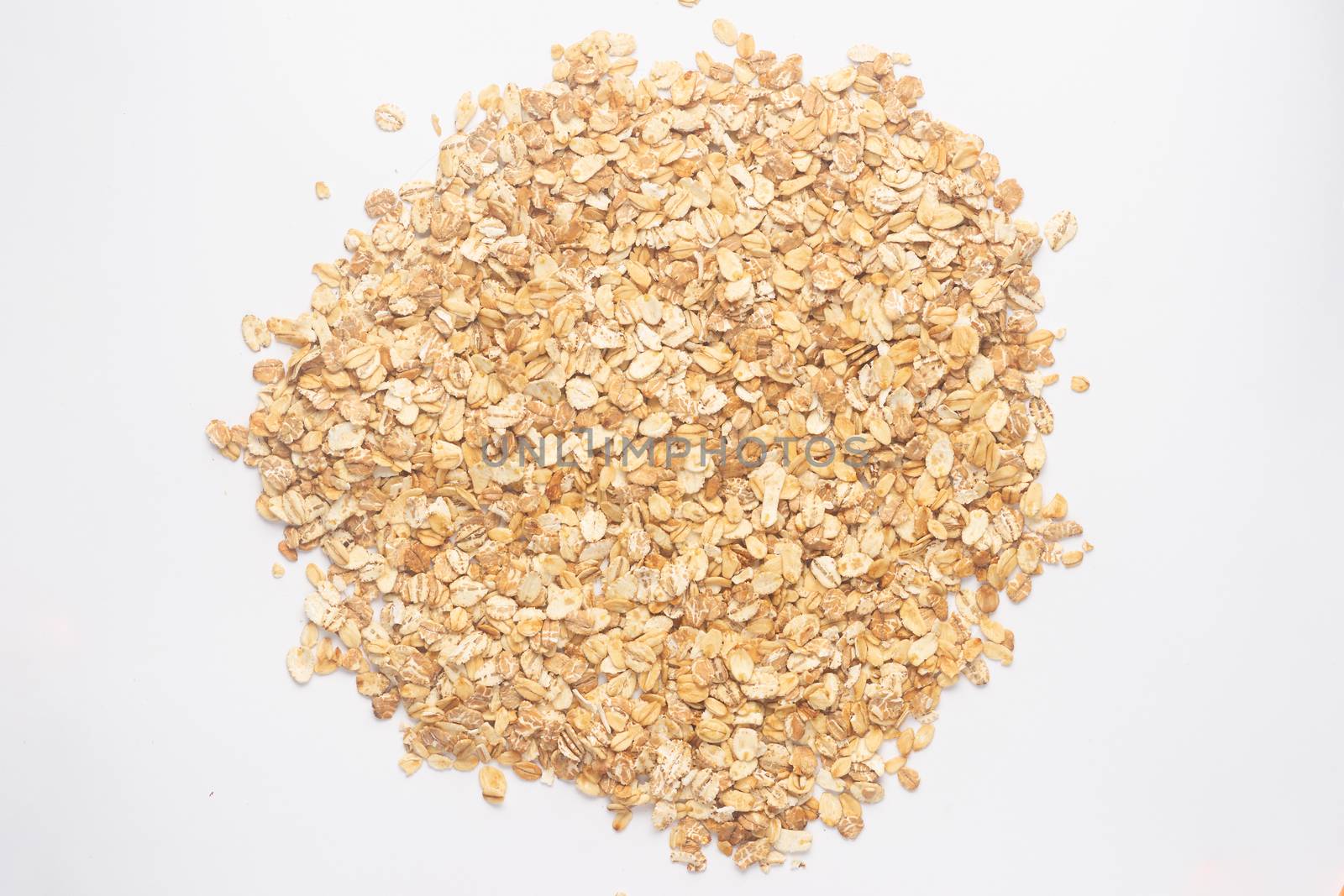 Cereal flakes for granola closeup. Flakes isolated on white back by alexsdriver