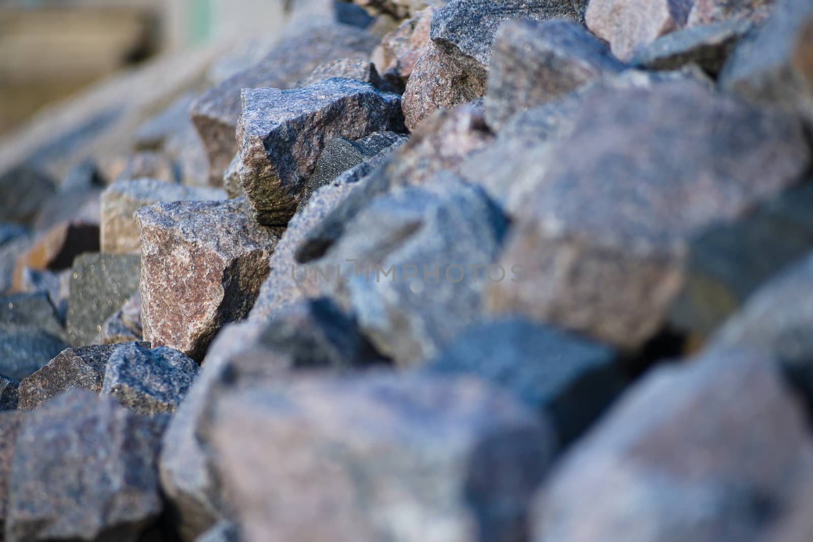 heap of stones on the river bank. heaped stones