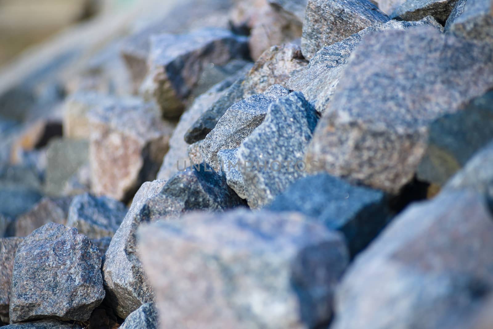 heap of stones on the river bank. heaped stones