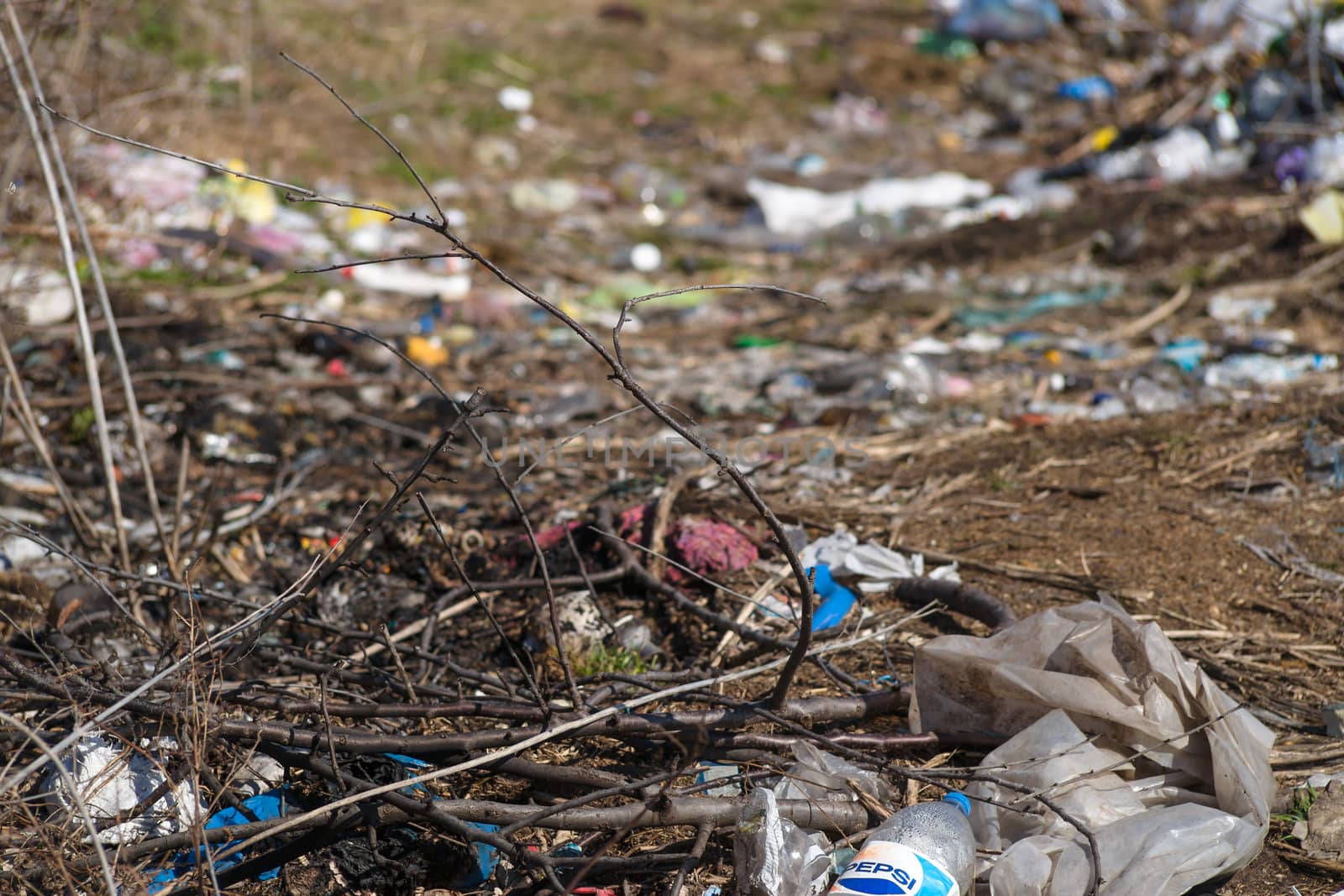 Trash on the agriculture field. Ecology problem and big harm to  by alexsdriver