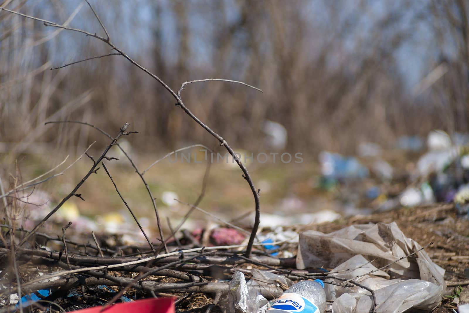 Trash on the agriculture field. Ecology problem and big harm to  by alexsdriver