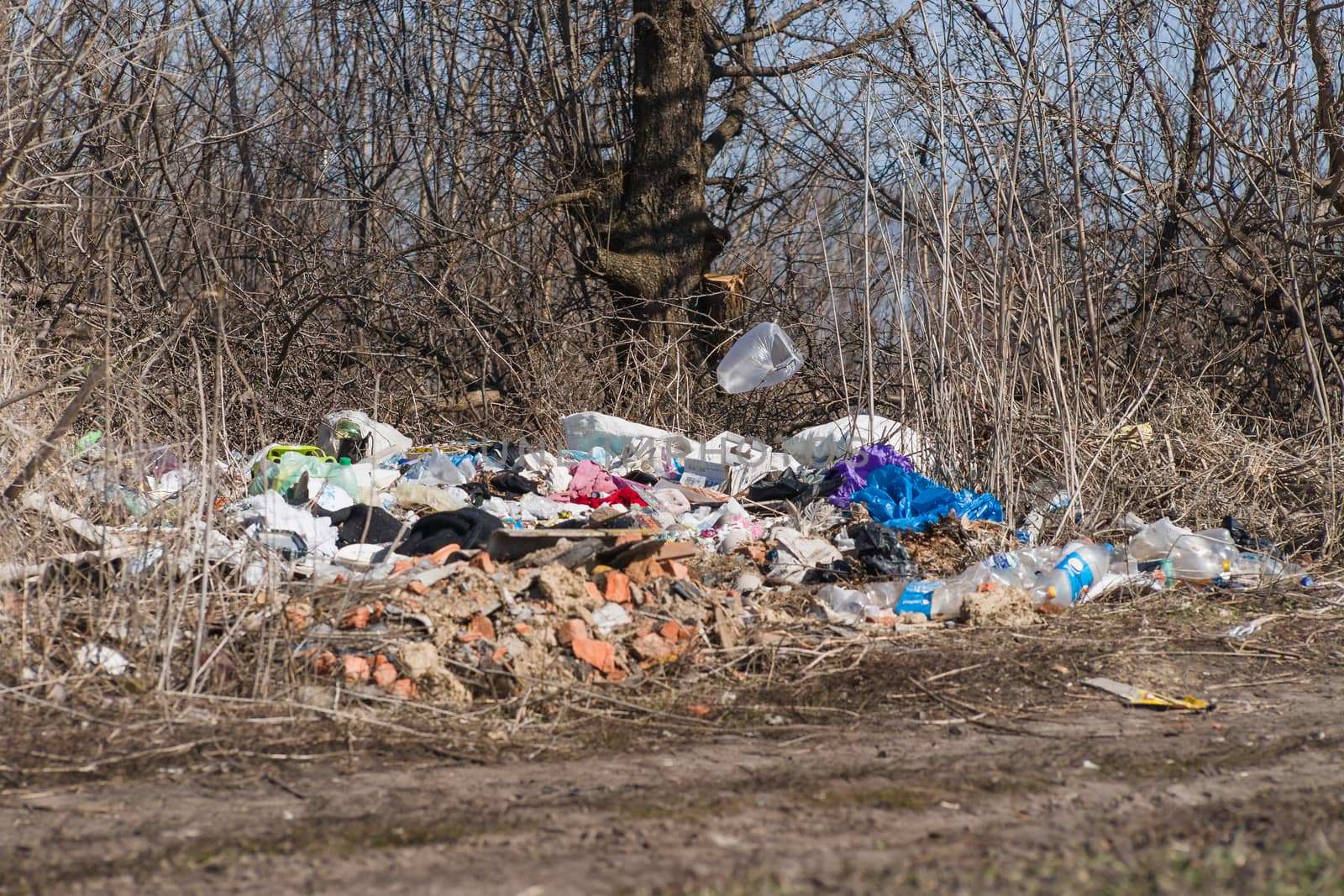 Trash on the agriculture field. Ecology problem and big harm to  by alexsdriver