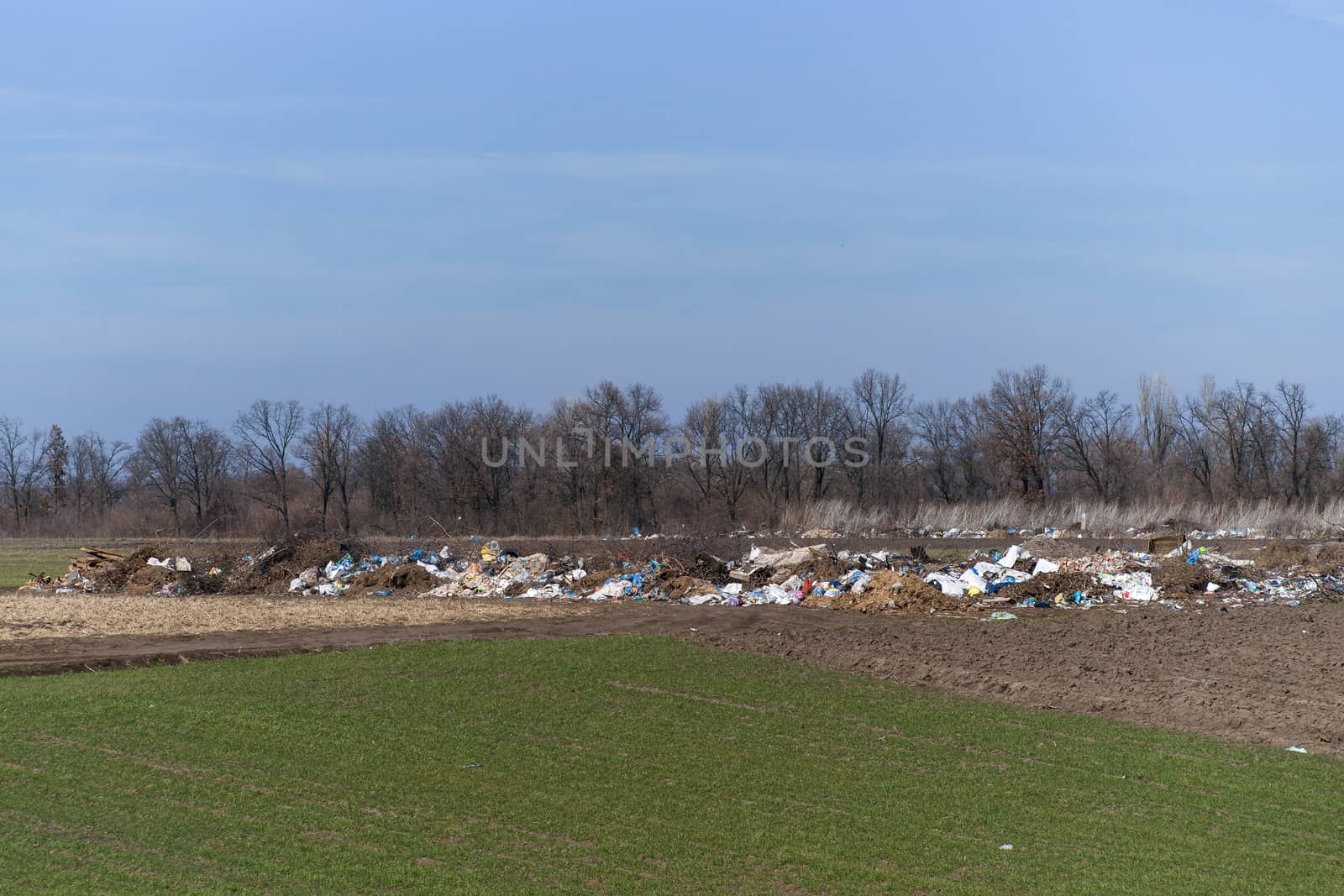Trash on the agriculture field. Ecology problem and big harm to nature. 