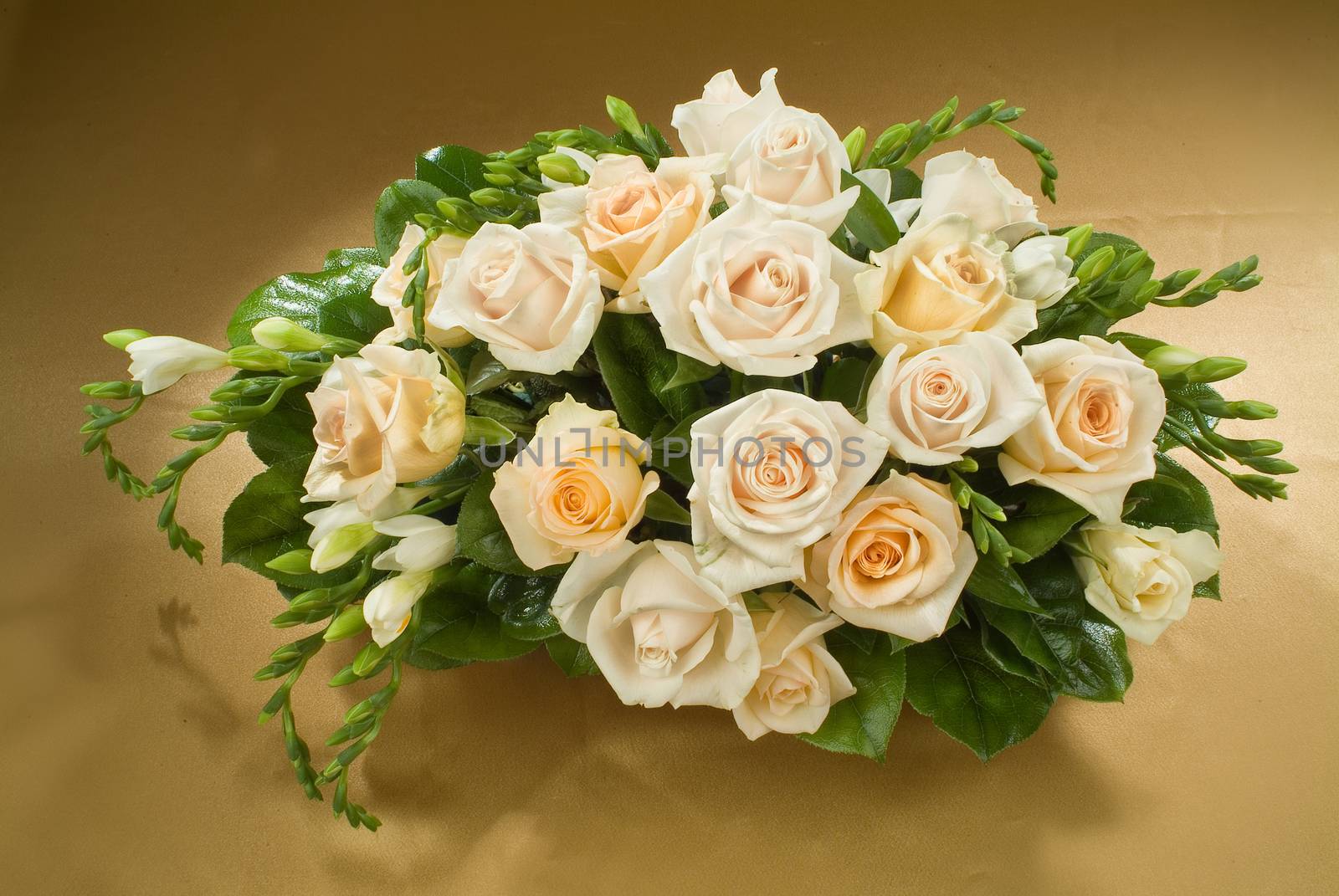 Still life with bouquet of flowers and accessories on a studio background