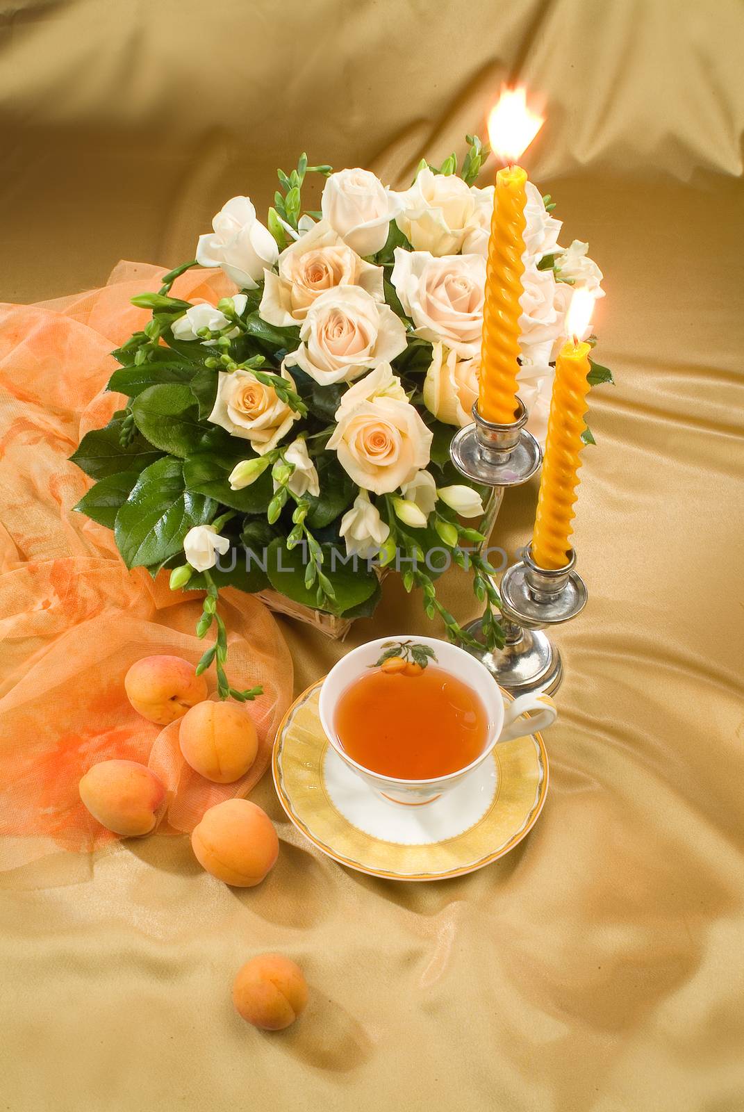 Still life with bouquet of flowers and accessories on a studio background