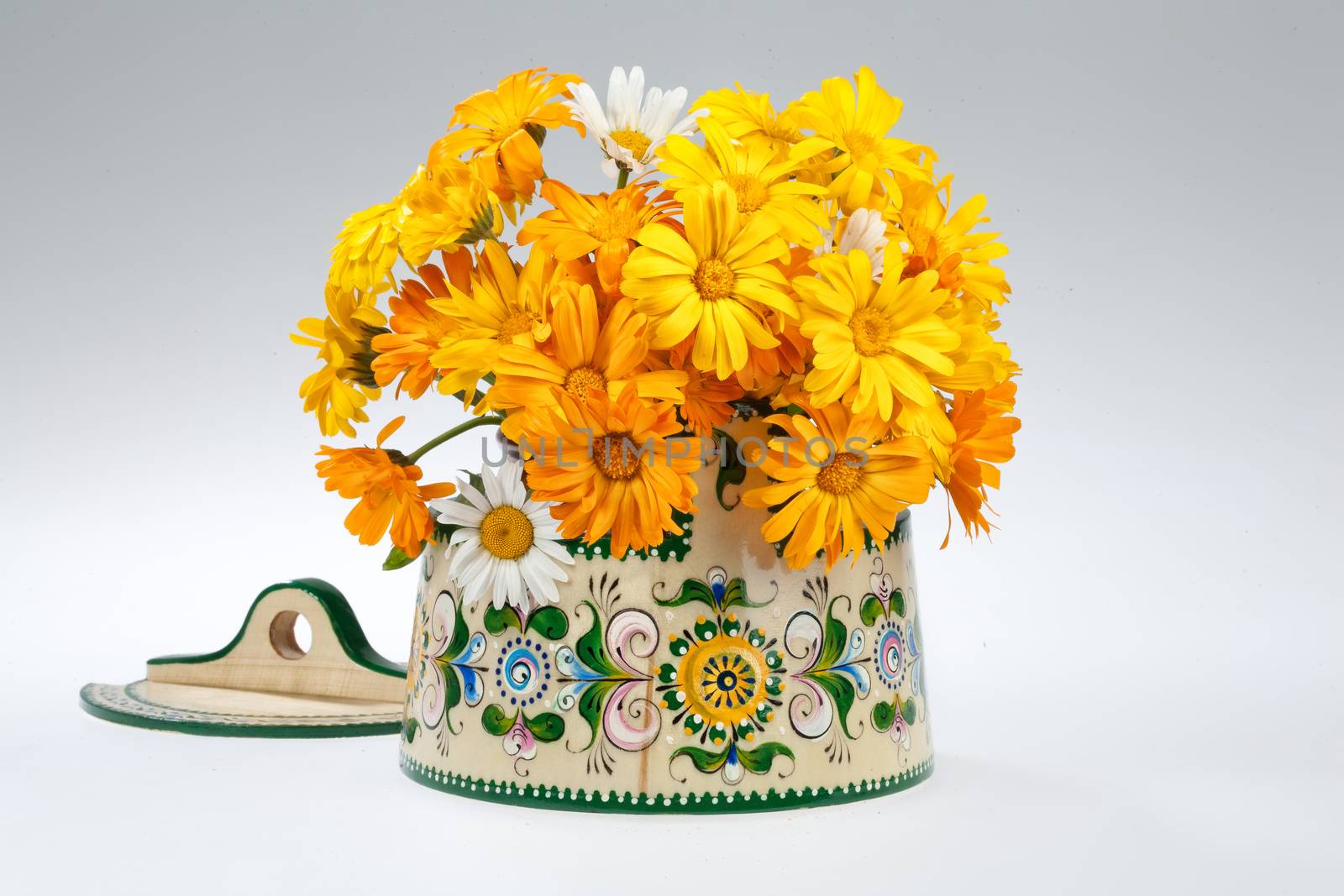 Still life with bouquet of flowers and accessories on a studio background