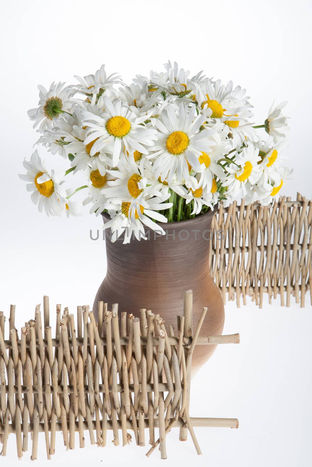 Still life with bouquet of flowers and accessories on a studio background