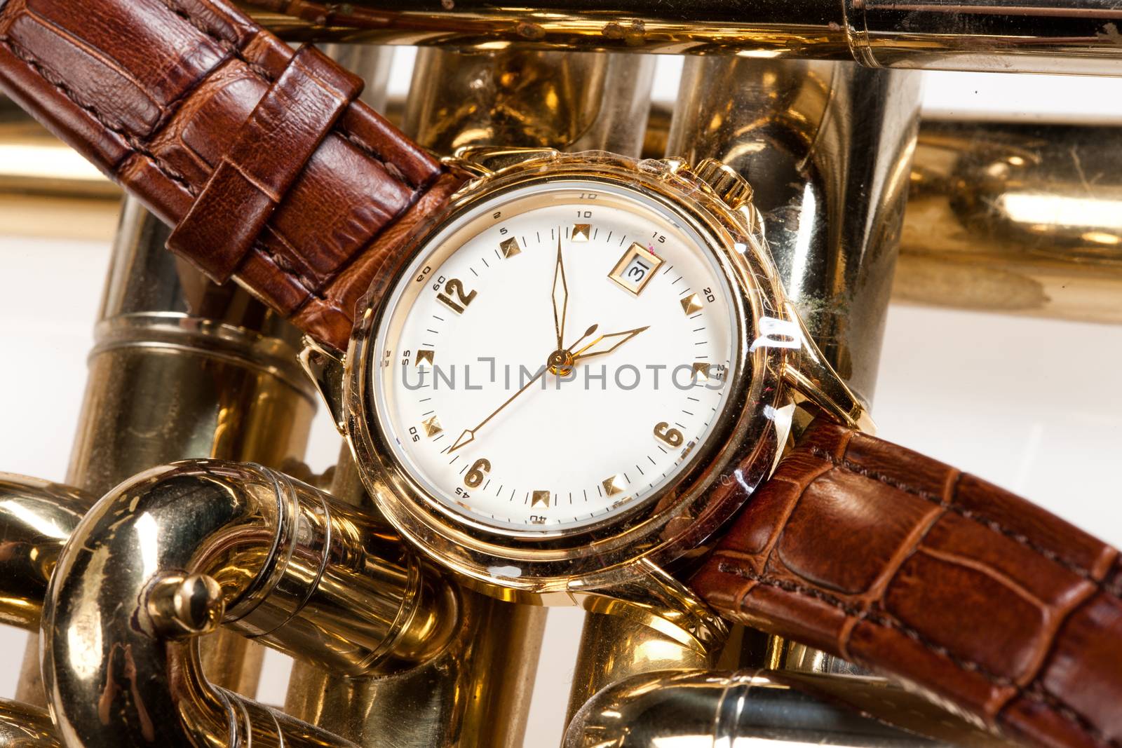 Wristwatch with leather belt on isolated background