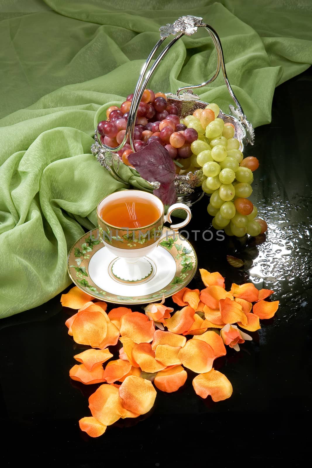 Still life with bouquet of flowers and accessories on a studio background