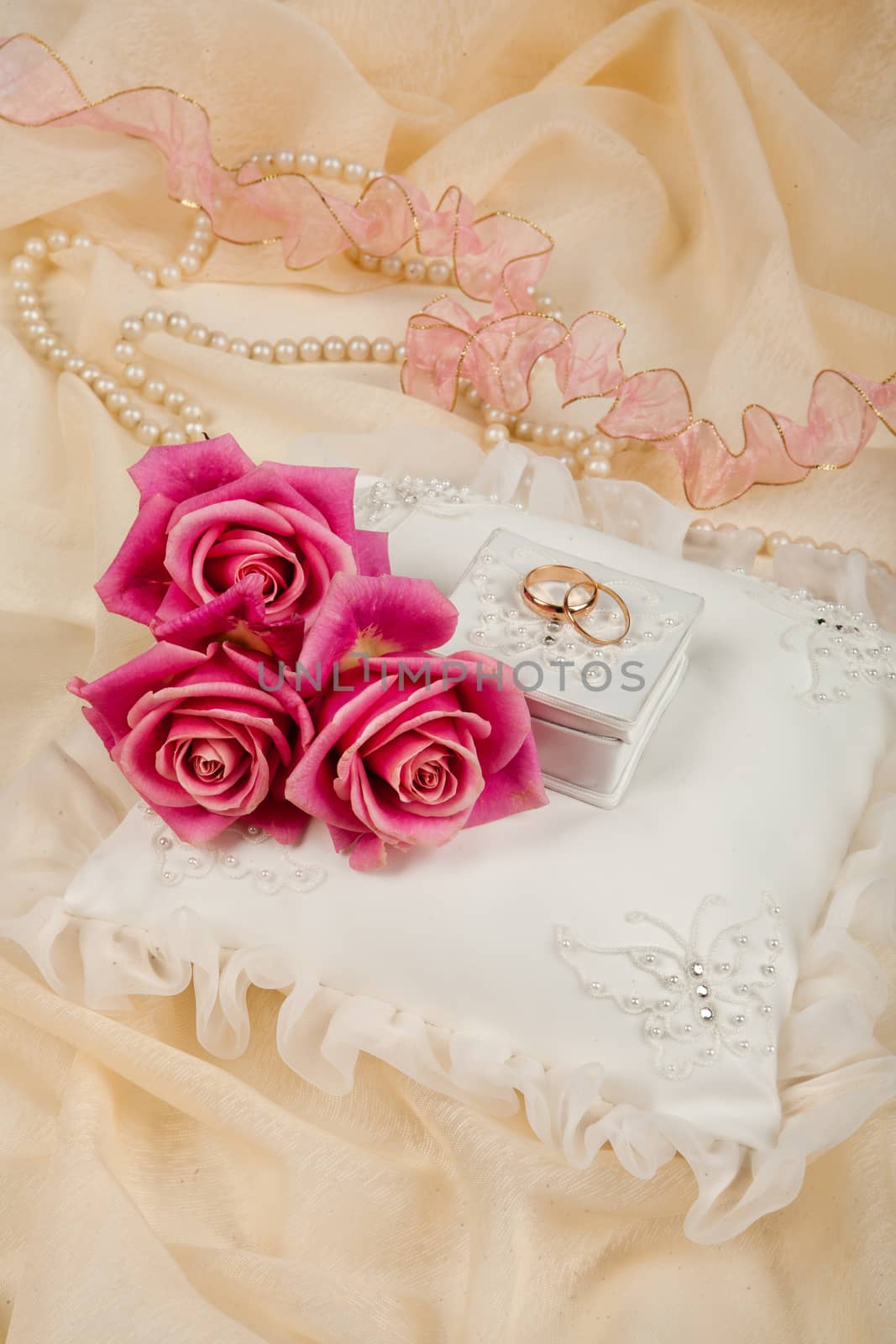 Still life with bouquet of flowers and accessories on a studio background
