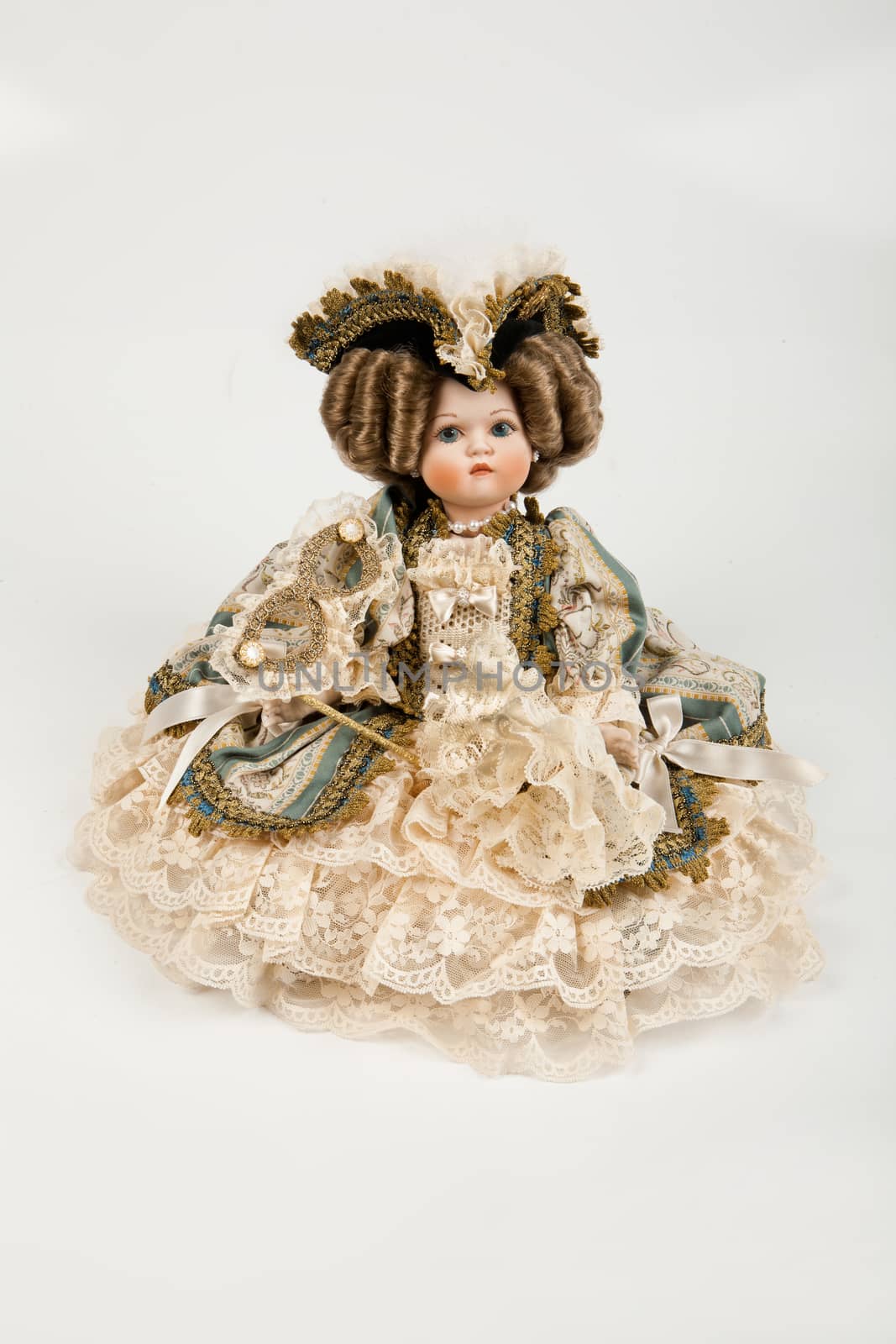 Doll dressed in vintage style on a studio background