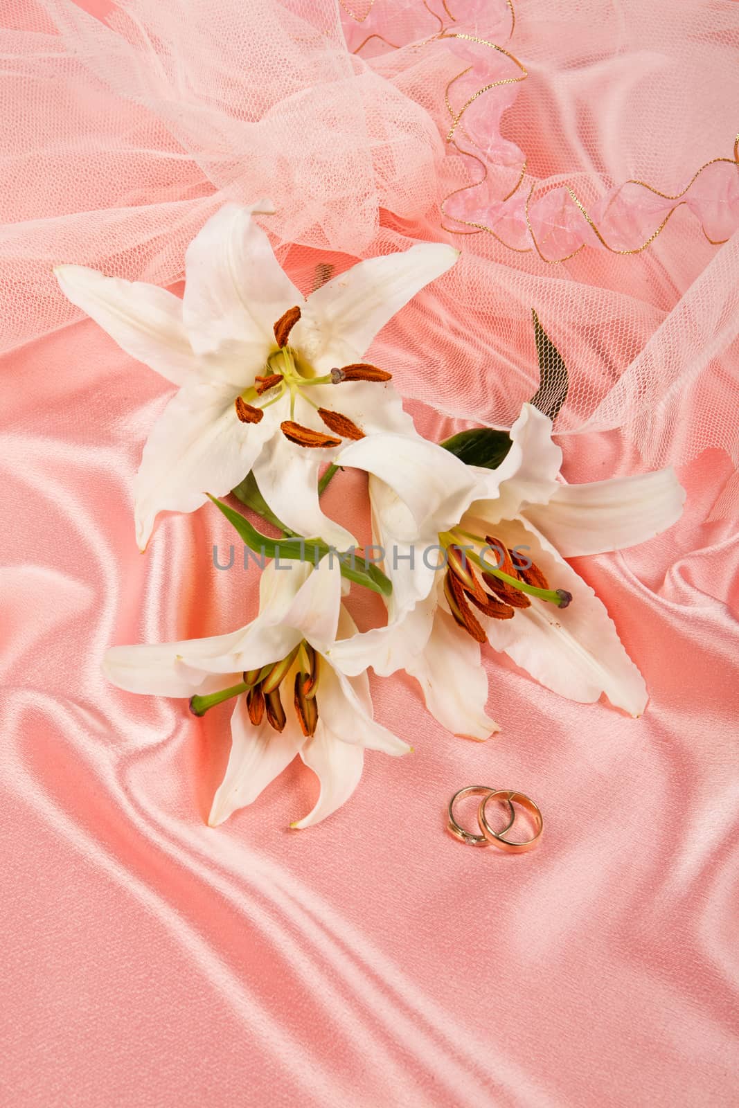 Still life with bouquet of flowers and accessories on a studio background