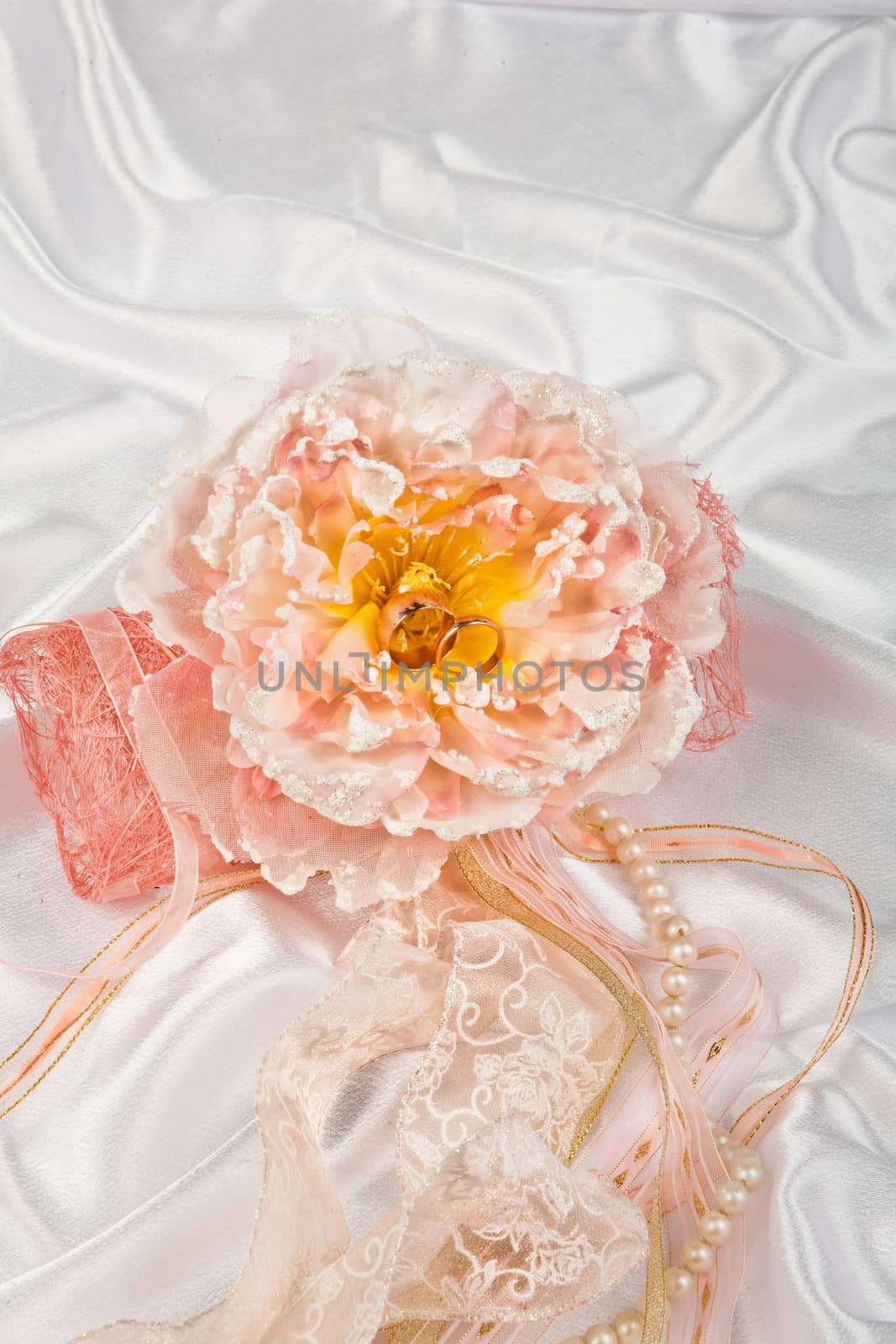 Still life with bouquet of flowers and accessories on a studio background