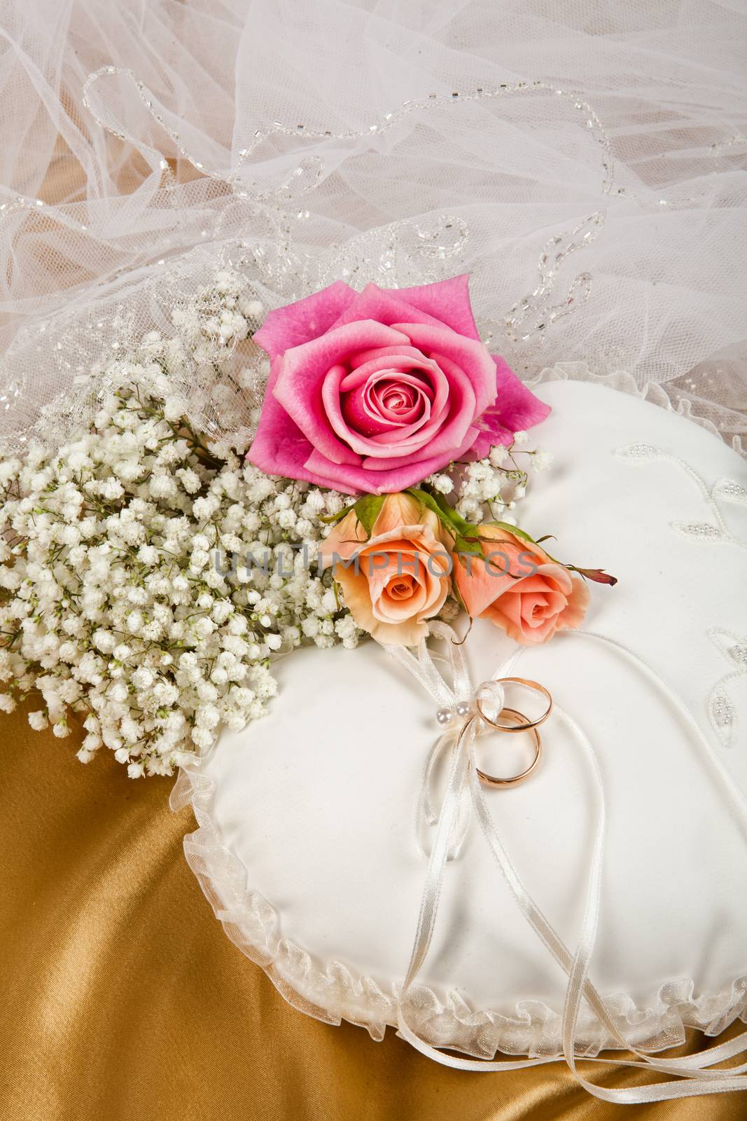 Still life with bouquet of flowers and accessories on a studio background