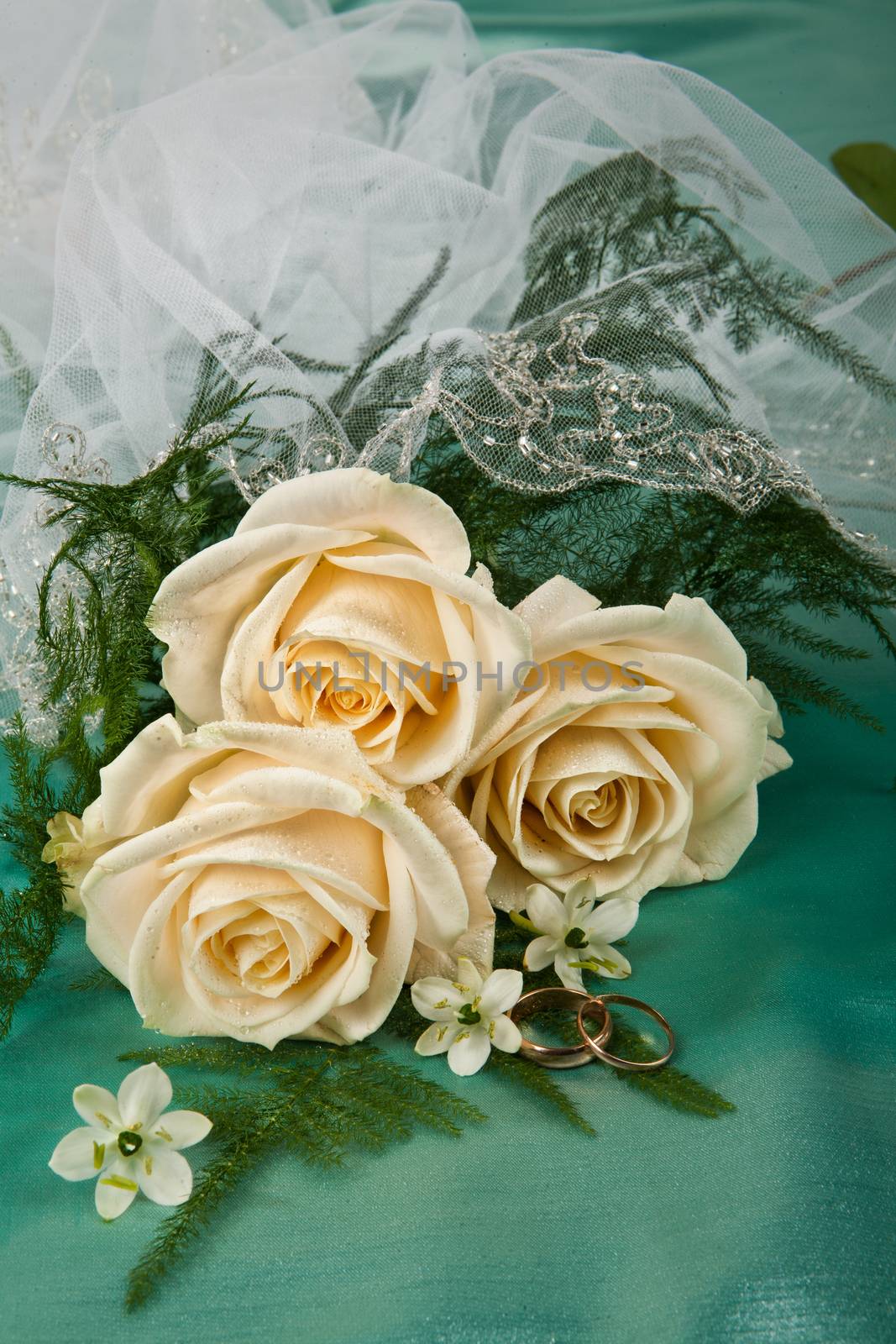 Still life with bouquet of flowers and accessories on a studio background