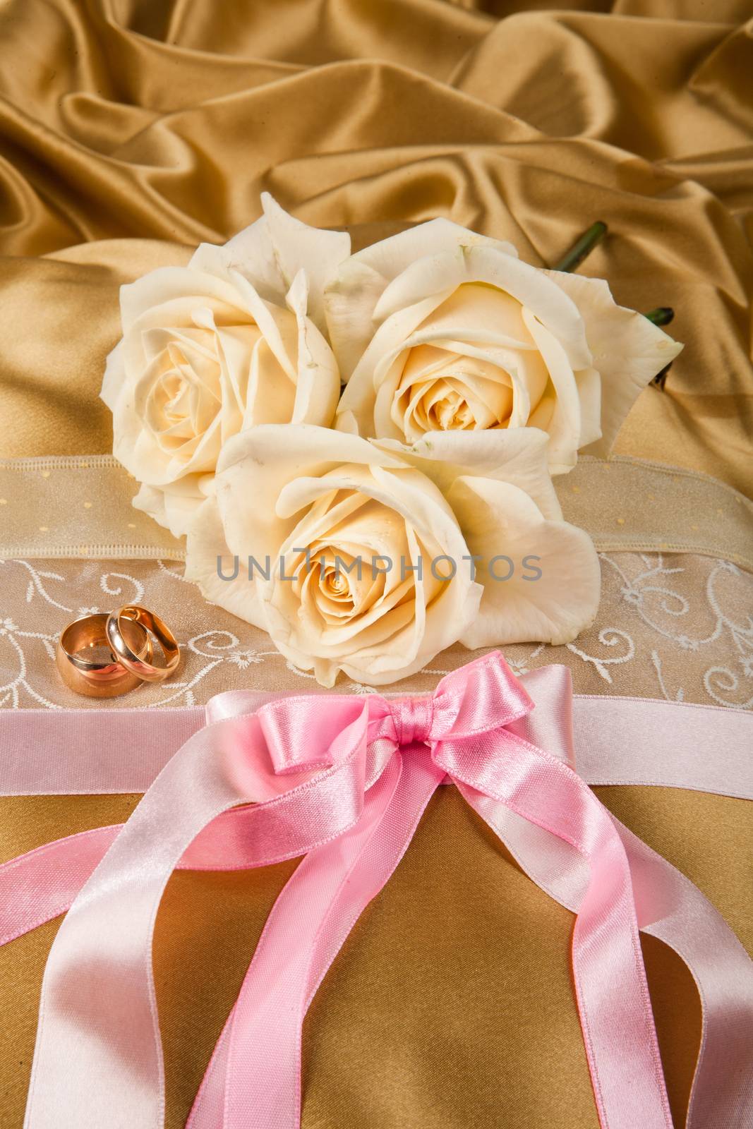 Still life with bouquet of flowers and accessories on a studio background