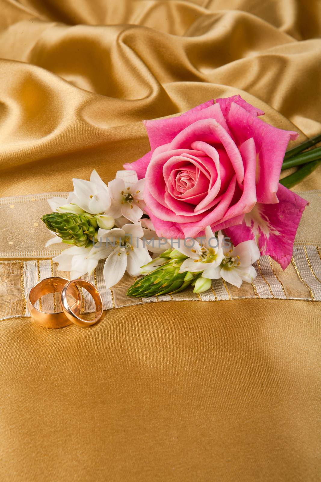 Still life with bouquet of flowers and accessories on a studio background