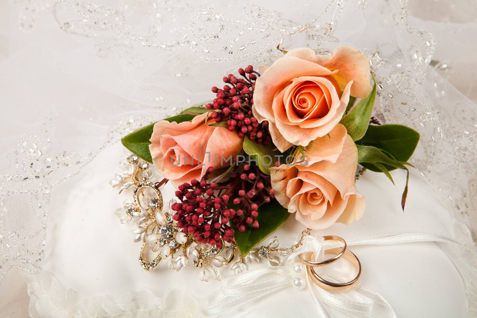 Still life with bouquet of flowers and accessories on a studio background