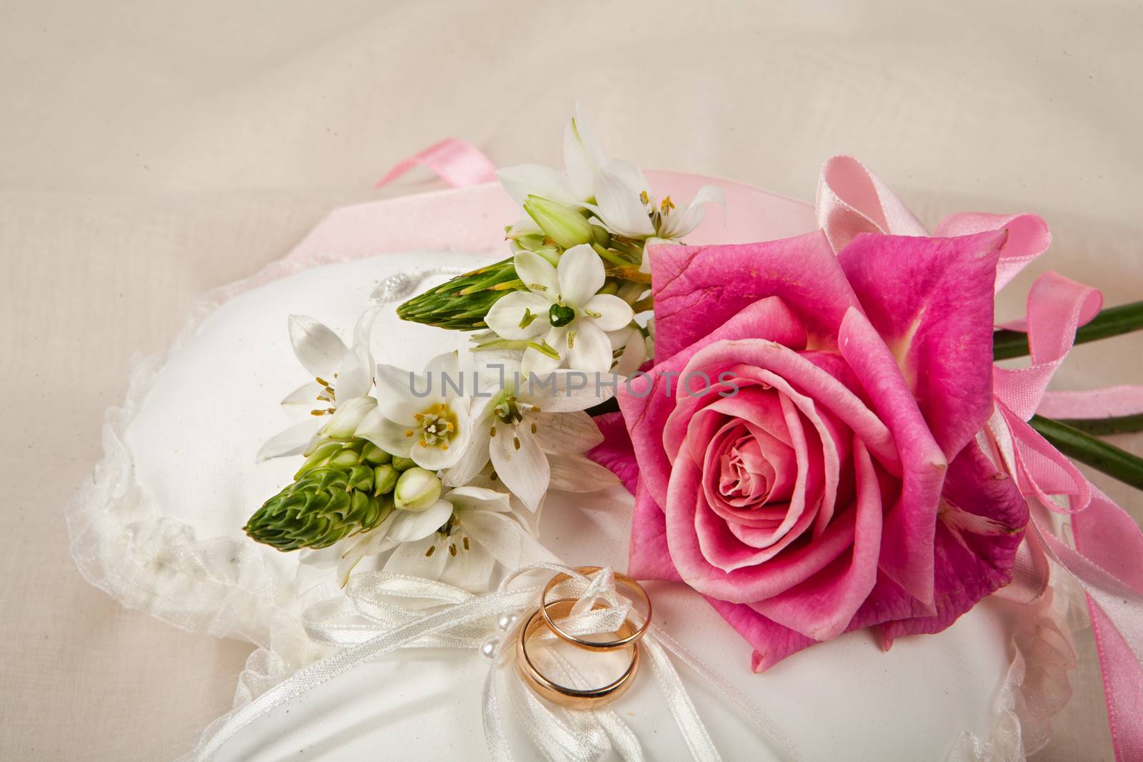 Still life with bouquet of flowers and accessories on a studio background