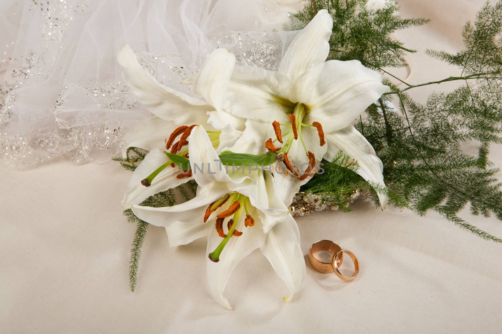 Still life with bouquet of flowers and accessories on a studio background