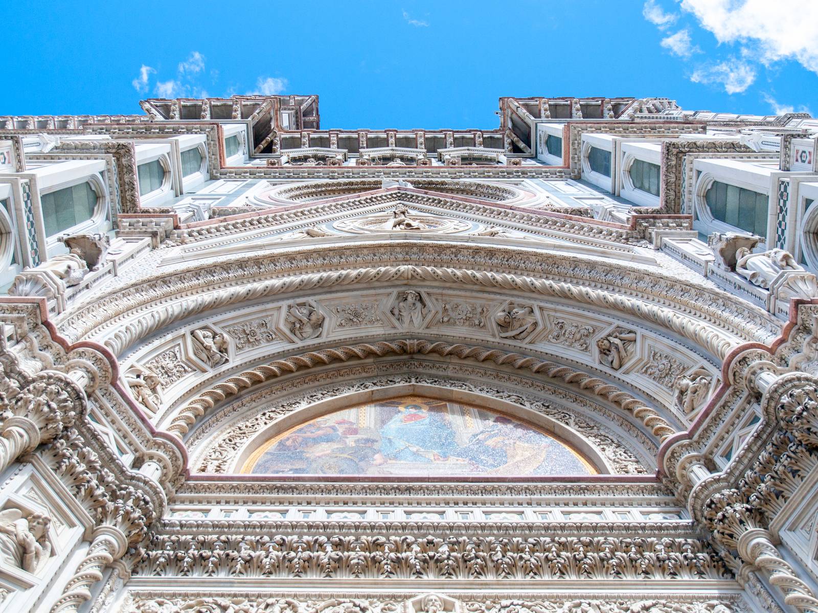 Main portal of Florence Catherdal, Cattedrale di Santa Maria del Fiore or Il Duomo di Firenze, with ornamental mosaic, Firenze, Tuscany, Italy.