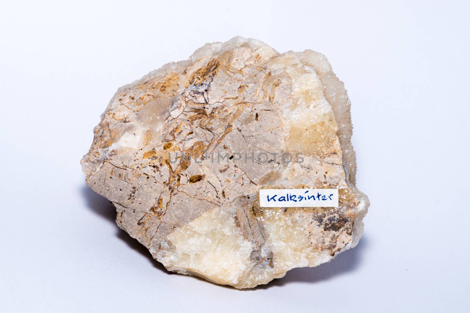 Calc-sinter white gemstone formed on an usual piece of bed rock