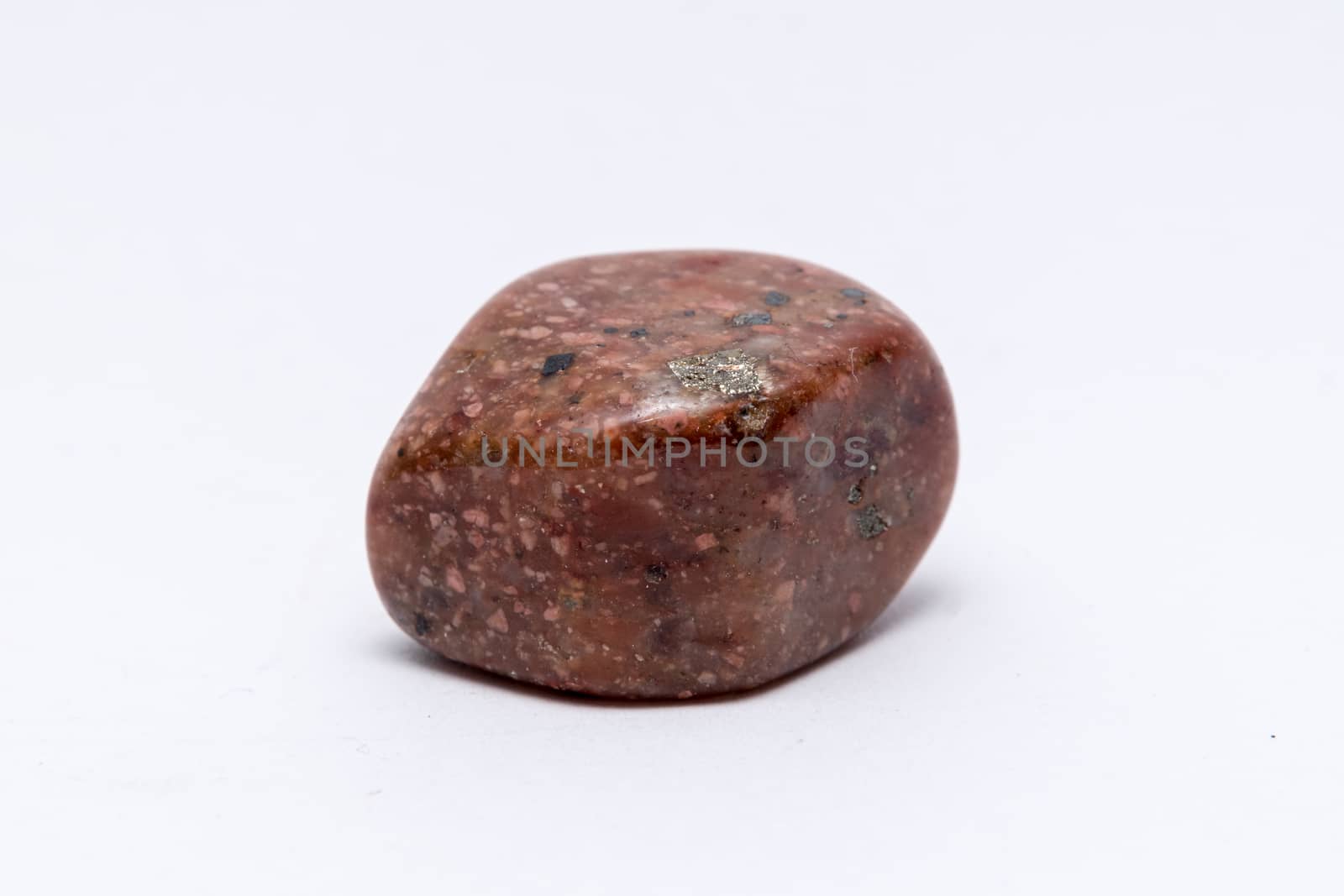 Unakit rare gemstone shiny polished different tones of brown red and orange