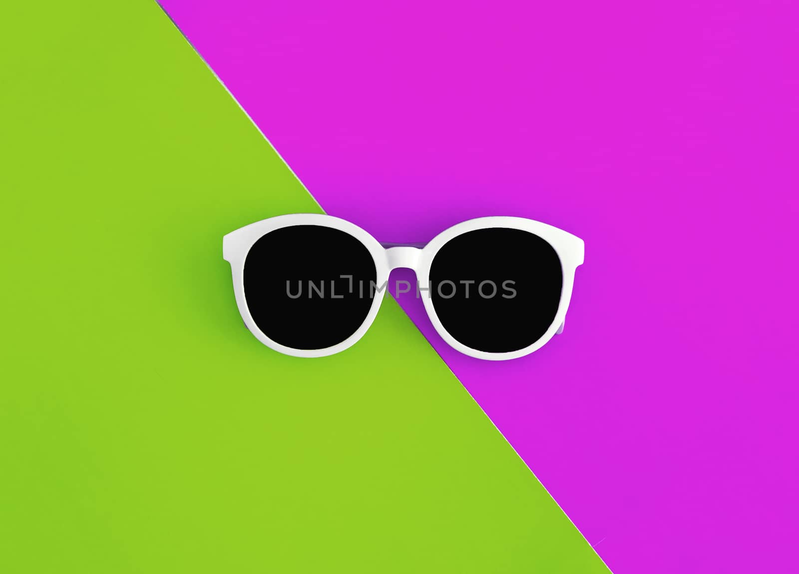 Sunny stylish white sunglasses on a bright green-cyan and crimson-pink background, top view, isolated. Copy space. Flat lay by Tanacha