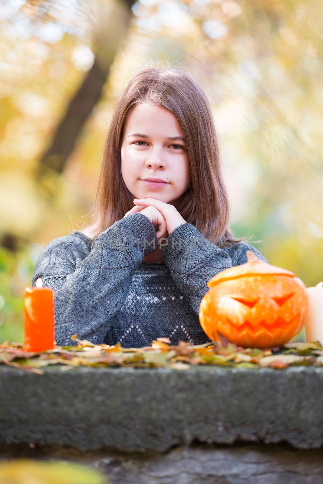Girls with pumpkins on Halloween by destillat