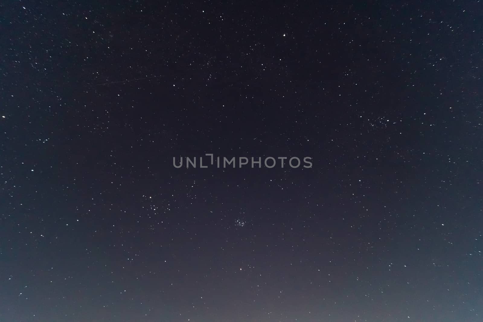  Underexposed night sky low light photo. A lot of stars and constellations on dark sky. Stock photo of deep sky.