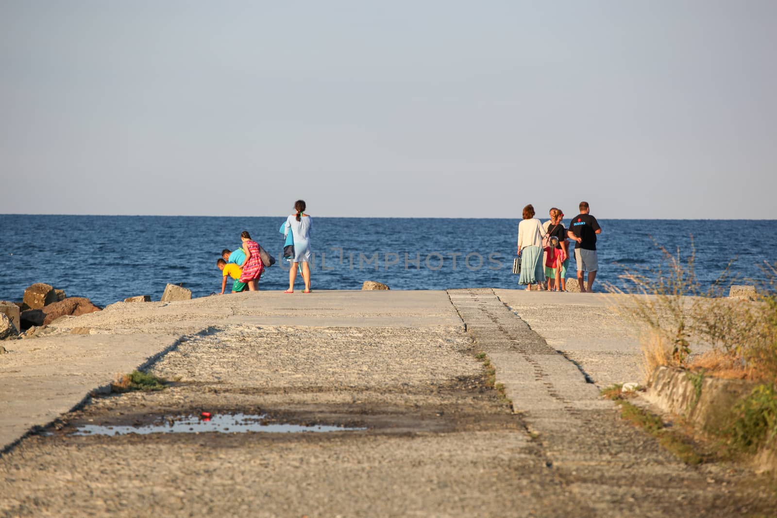 Pomorie, Bulgaria - July 12, 2019: People Relaxing On The Beach.