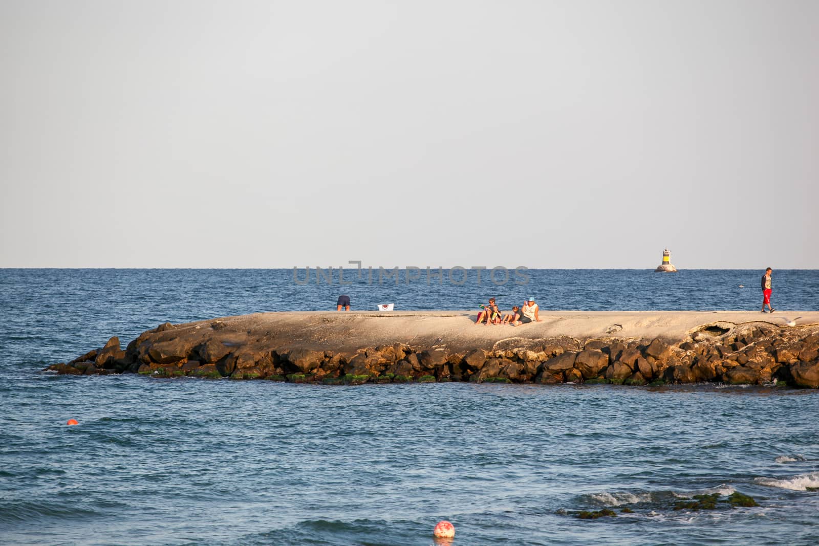 Pomorie, Bulgaria - July 12, 2019: People Relaxing On The Beach. by nenovbrothers